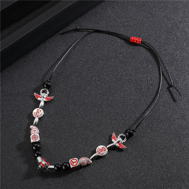 Venta al por mayor aleación Smiley Skull Angel collar de perlas negras